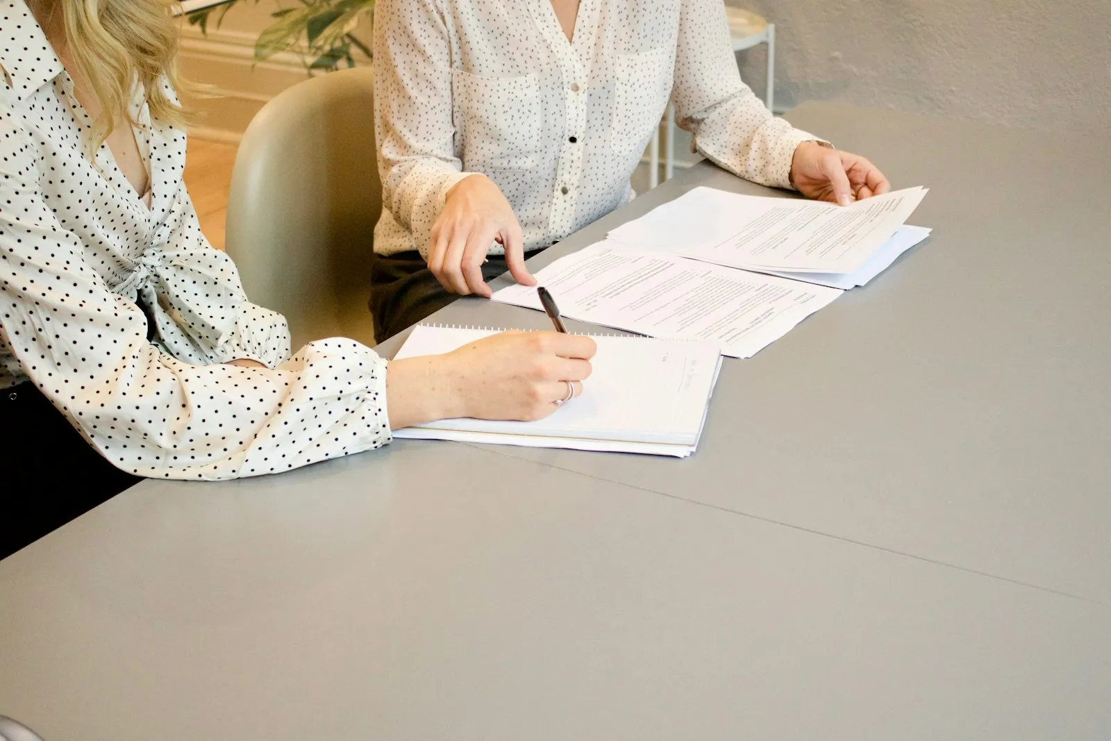 Attorney and client reviewing documents together