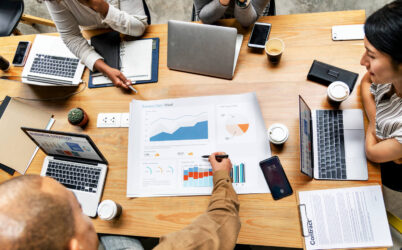 66a8ae222e6fbd03682876c5 Business Man Pointing At A Graph At A Business Meeting