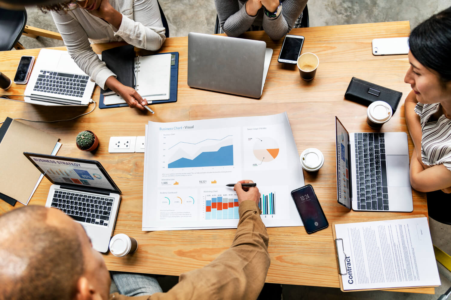 66a8ae222e6fbd03682876c5 Business Man Pointing At A Graph At A Business Meeting